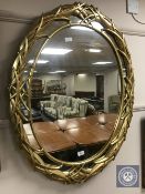 An ornate gilt framed mirror