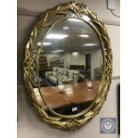 An ornate gilt framed mirror