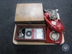 A tray of vintage red telephone, wooden cased neutral earth loop tester,