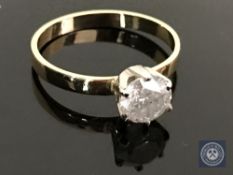 An 18ct yellow and white gold diamond solitaire ring featuring a brilliant cut diamond 1.15ct.