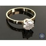 An 18ct yellow and white gold diamond solitaire ring featuring a brilliant cut diamond 1.15ct.