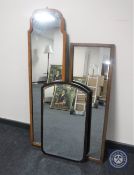 A mahogany framed hall mirror together with an oak framed hall mirror and further mahogany bevelled