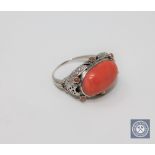 An antique coral ring set in white gold, size O CONDITION REPORT: In good condition.