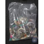 A bag containing a large quantity of costume jewellery