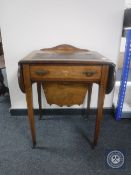 A Victorian inlaid mahogany flap sided sewing table