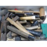 A crate containing hammers and mallets