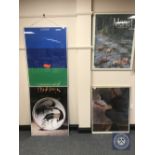 A framed Kastrup airport poster and three framed gallery prints
