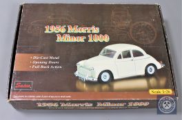 Saico 1:26 scale Morris Minors - A box of twelve car models and three individual commercial vans.