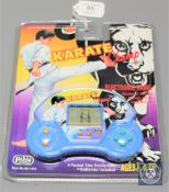 A Play-tech electronic game - Karate Champ, factory sealed.