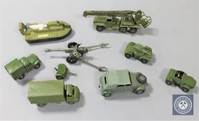 Eight original Dinky military vehicles; 641 1 Ton Cargo Truck (1954-62), 670 Armoured Car (1954-65),