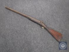 A 19th century percussion cap double-barrelled shotgun CONDITION REPORT: No apparent