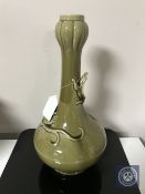 A Christopher Dresser designed vase, olive green with Art Nouveau style salamander detailing,