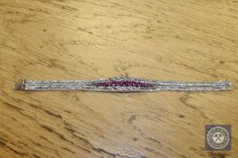 An 18ct white gold ruby and diamond set bracelet CONDITION REPORT: 38.2g.