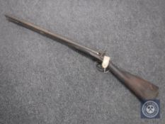 A 19th century percussion cap double-barrelled shotgun CONDITION REPORT: Feint