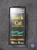 A vending box with Black Cat Cigarette advertising