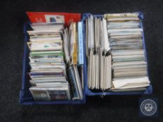 Two baskets of 20th century and later postcards,