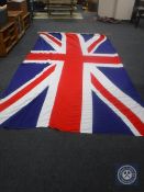 A large Union Jack flag CONDITION REPORT: Approximately 450cm by 250cm.