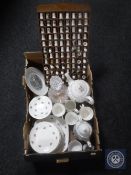 A box of cut glass decanter, thimble rack, thimbles,