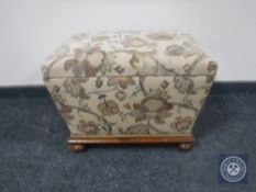 A Victorian sarcophagus storage footstool in floral fabric