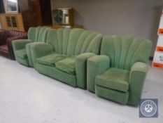 A three piece Art Deco lounge suite in a green fabric