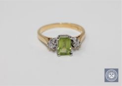 An 18ct gold peridot and diamond ring,