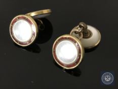A pair of gold and mother of pearl cufflinks, stamped 18ct.