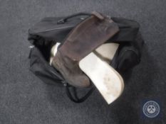 A holdall containing riding boots,