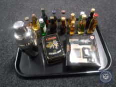 A tray of alcohol miniatures and cocktail shaker
