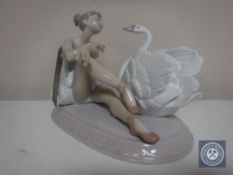 A Lladro figure - Seated ballerina with swan,