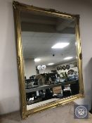 An ornate gilt framed bevelled mirror