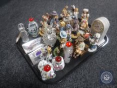 A tray of eight perfume bottles including six oriental items and collection of ten Leonardo figures