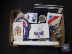 A box of commemorative memorabilia, mugs and glasses,