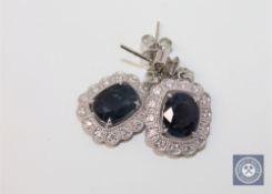 A pair of 18ct white gold sapphire and diamond earrings,