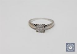 An 18ct white gold six stone diamond square set cluster ring, approximately 0.14ct, size K 1/2.