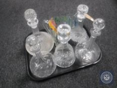 A tray of five decanters together with a hand painted jug and five beakers