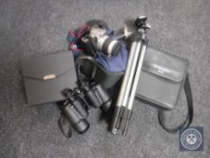 A camera tripod together with a Canon Eos 3000 digital camera in bag and two sets of cased