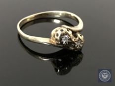 A 9ct gold diamond crossover ring, size N CONDITION REPORT: 1.