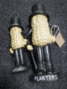 Two cast metal Mr Peanut money boxes