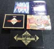 Five editions of Monopoly including Millennium, European,
