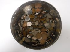 A tin containing pre-decimal copper pennies, half crowns,