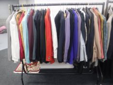 A rail of gent's jackets, coats, blazers, tuxedos and two-piece suits - Armani, Pierre Cardin,