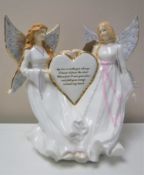 A Royal Worcester figure - Wings Around my heart.