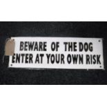 A cast iron plaque "beware of the dog"