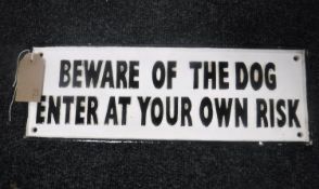 A cast iron plaque "beware of the dog"