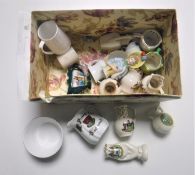 A box containing assorted tourist china and a china dolly top