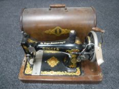 A vintage cased hand Singer sewing machine