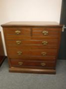 An Edwardian mahogany five drawer chest,