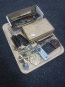 A tray of assorted collectable's including hair curlers, folding coat hangers, vintage spectacles,