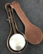 A Harmony USA five-string banjo in hard carry case