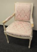A contemporary washed pine armchair upholstered in a pink classical fabric